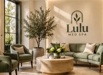 Sage green waiting lounge with an olive tree